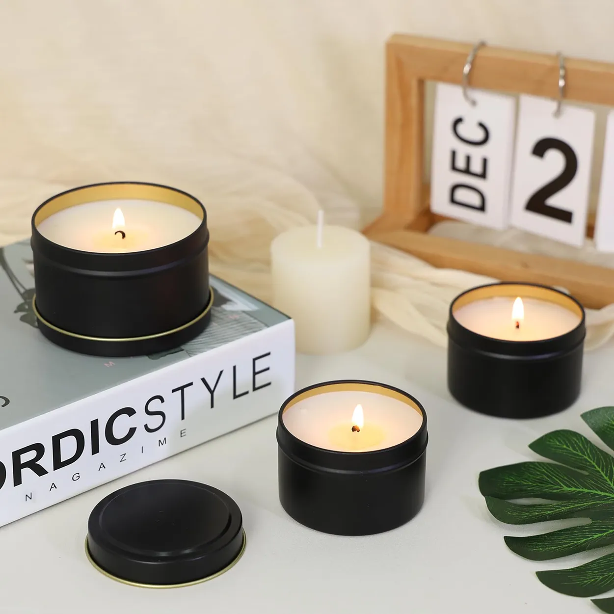 A couple of candles sitting on top of a table.